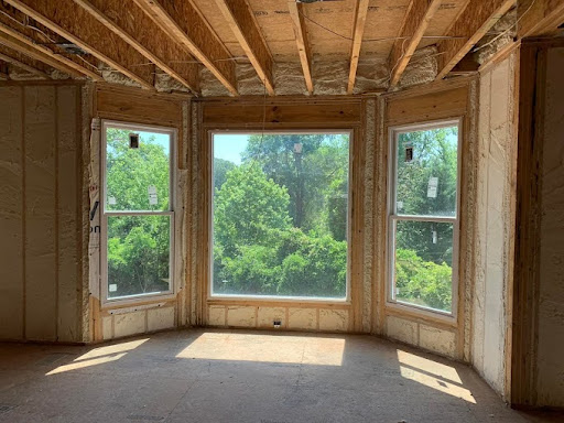 spray foam insulation installed between the wall studs and ceiling joists