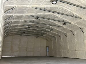 Closed cell spray foam in the ceiling and walls of a metal building.