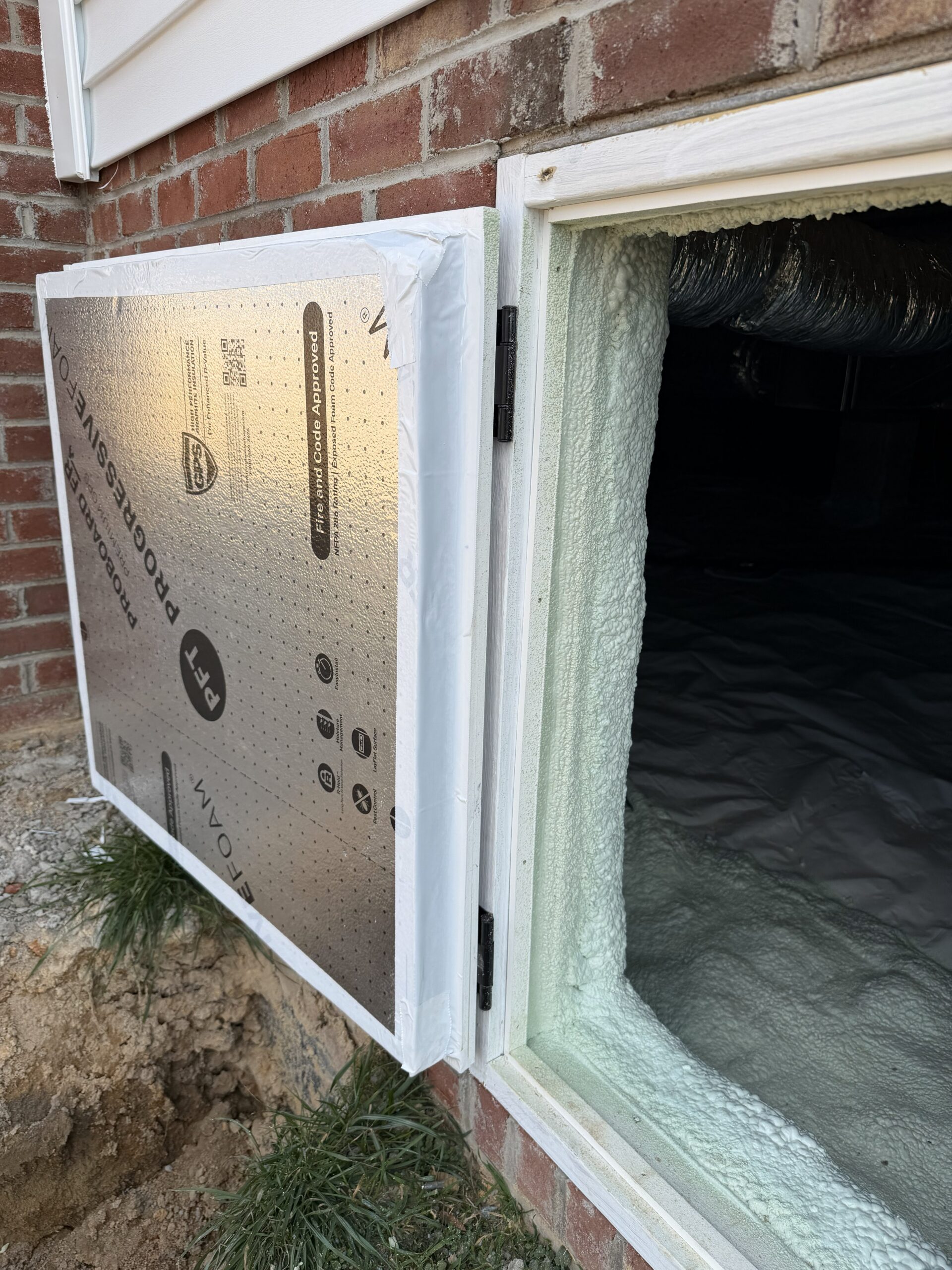 An encapsulated crawl space with an insulated door.