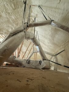 Open cell spray foam installed in an attic.