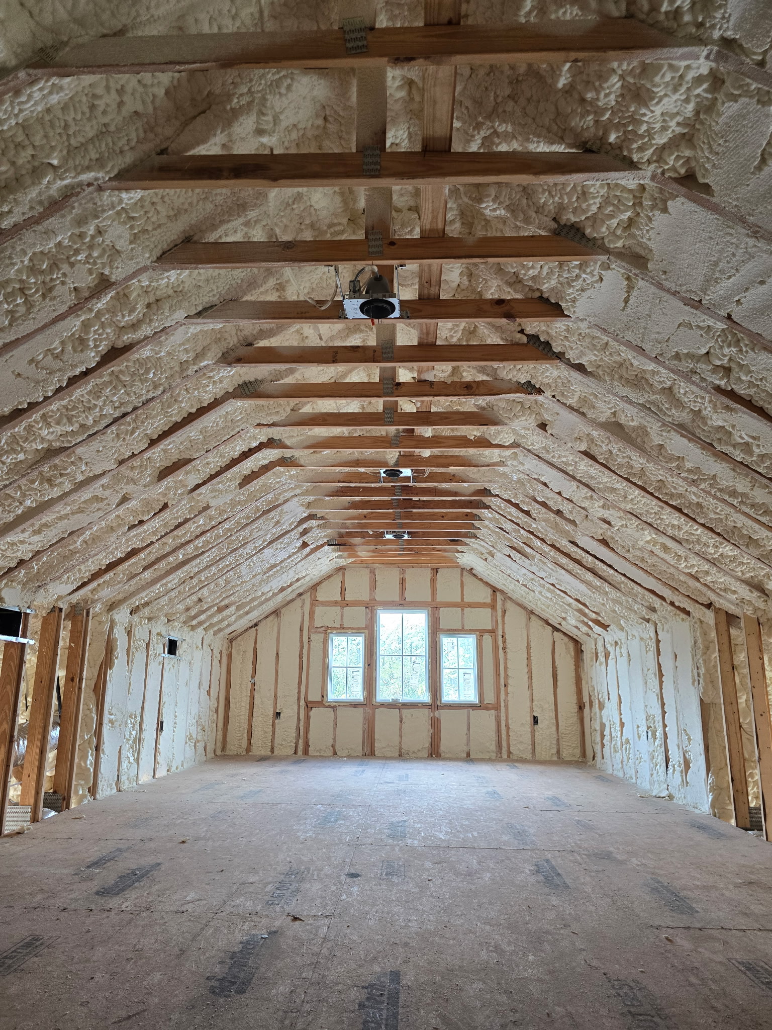 Open cell spray foam installed in the slopes of a new build home.
